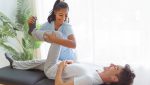 how-flexion-distraction-therapy-could-help-you-feel-relief-person-getting-chiropractic-adjustment-on-special-table