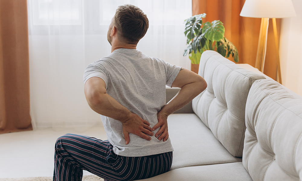lower-back-pain-quick-tip-man-holding-his-lower-back